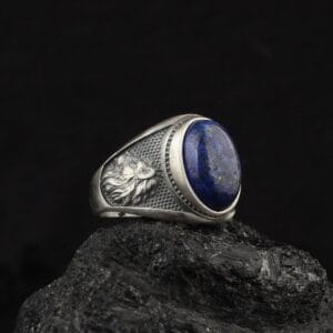 The Handmade Lion Ring is a product of sterling silver jewelry with lapis lazuli gemstone on top of it.