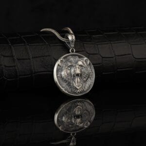 Bear Medallion is a sterling silver necklace for stylish men. In this image there is a roaring bear crafted in a necklace. It might seem scary but dont worry it is only there to encourage you.