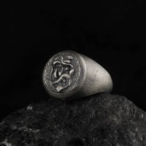 pirate skull rings is a sterling silver signet ring with skull ornaments on top of it.